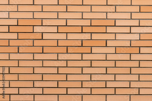 brickwork of a brick wall of a warm light shade 