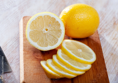 Sliced lemon on wooden table