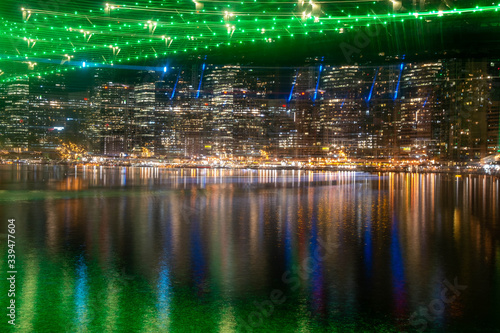 Brisbane CBD reflecting off the Brisbane River underneath the Story Bridge