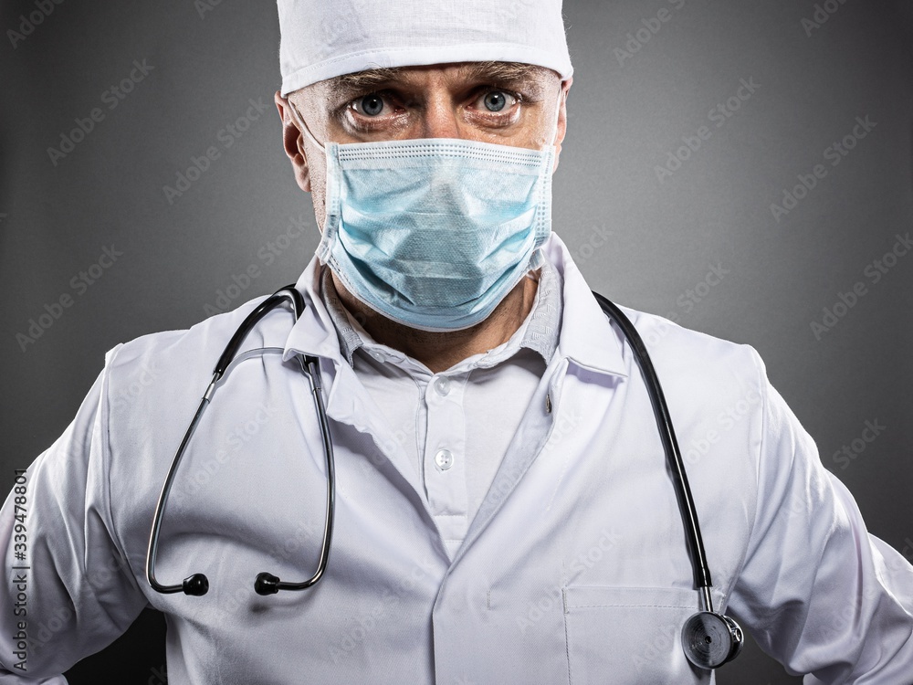Doctor in protective medical mask and white uniform Doctor in protective medical mask and white uniform