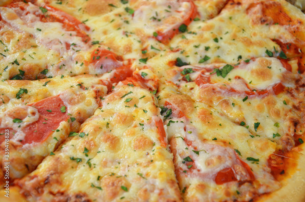 Pizza Margherita in the box, top view. Pizza Margarita with Tomatoes, Basil and Mozzarella Cheese close up. texture Pizza Margherita in the box, top view. Pizza Margarita with Tomatoes, Basil and Mozzarella Cheese close up. texture