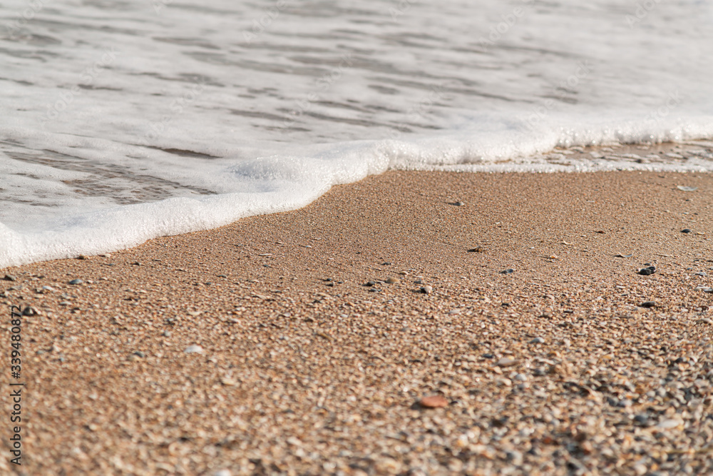 wave of blue ocean on sandy beach. texture Background. wave of blue ocean on sandy beach. texture Background.