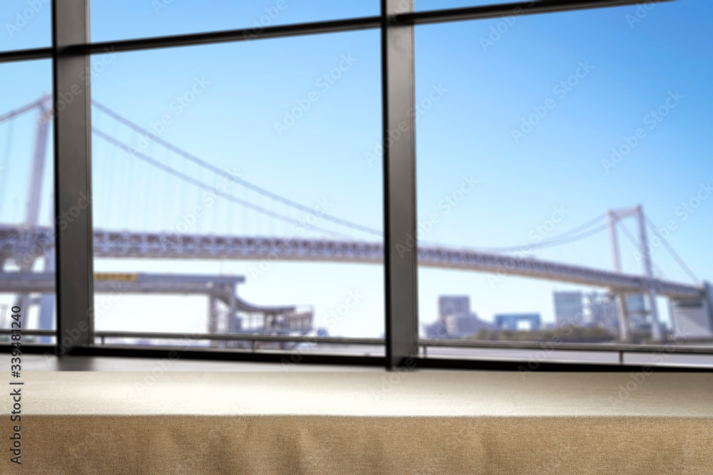 Fototapeta premium Table background of free space and blurred window background 