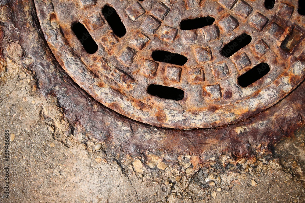 rusty manhole cover with beautiful colours and textures rusty manhole cover with beautiful colours and textures
