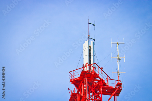 Cellular antenna and telecommunications against the blue sky. Copy space.