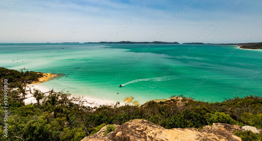Whitehaven beach landscape with boat trail on the water. Whitsundays Islands, Queensland, Australia. 