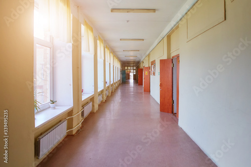 An empty school corridor stretching into the future. The concept of holidays, quarantine, evacuation