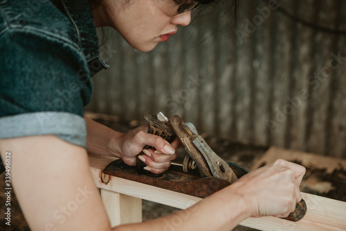 Carpenter shaving off wood
