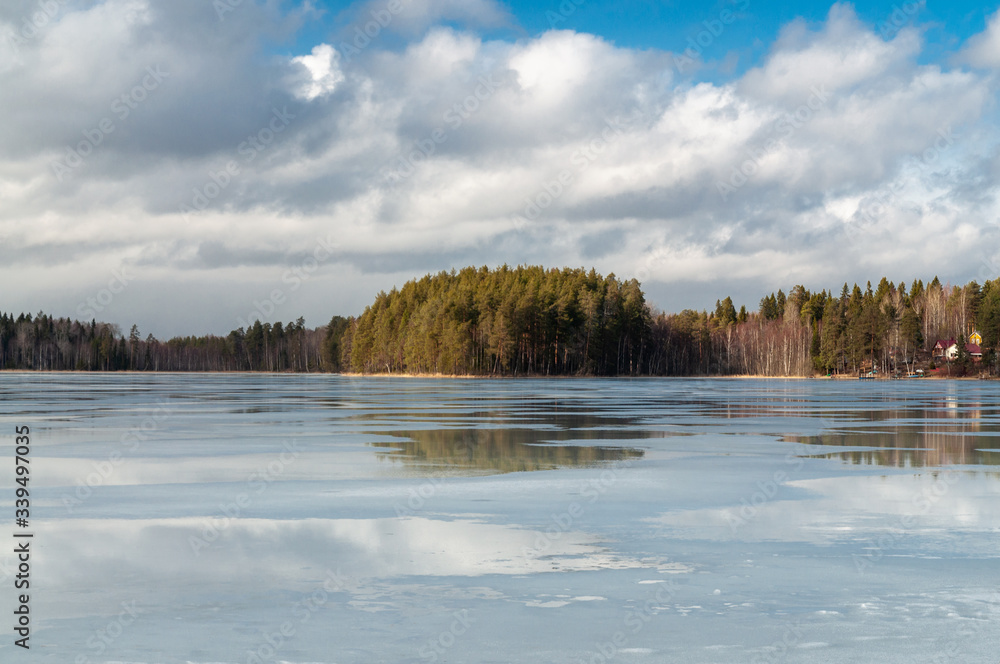 winter landscape with a frozen lake and clouds above it winter landscape with a frozen lake and clouds above it