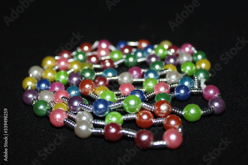 row of colorful Pearl strings abstract background