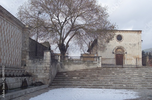 Fountain of the 99 Spouts, Historic fountain with 99 jets distribuited along three walls, L Aquila, Italy photo