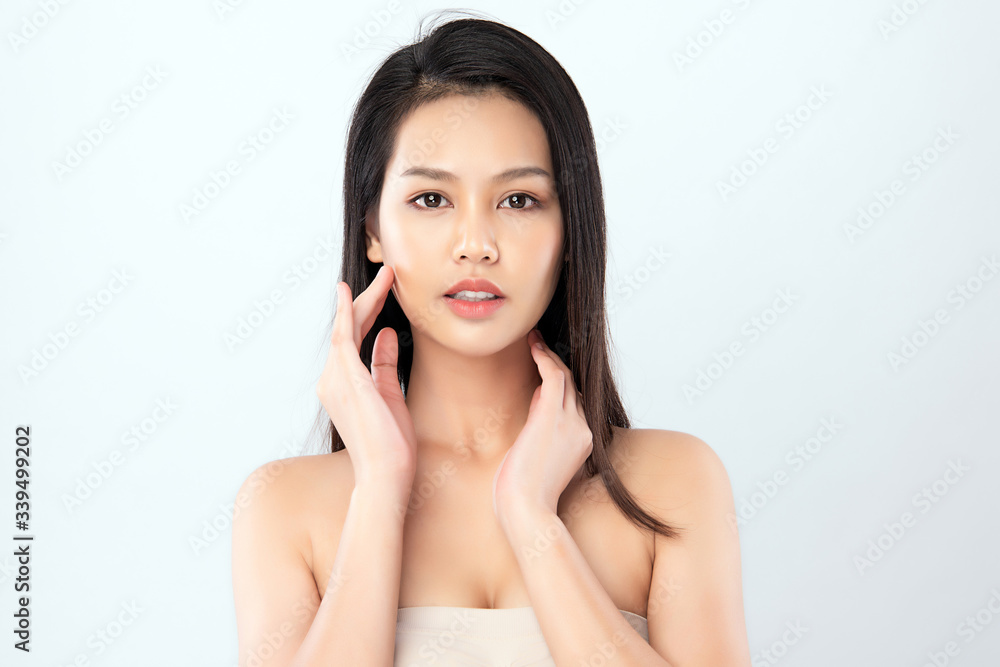 Beautiful Young Asian Woman with Clean Fresh Skin. Face care, Facial treatment, Cosmetology, beauty and healthy skin and cosmetic concept, woman beauty skin isolated on white background Beautiful Young Asian Woman with Clean Fresh Skin. Face care, Facial treatment, Cosmetology, beauty and healthy skin and cosmetic concept, woman beauty skin isolated on white background