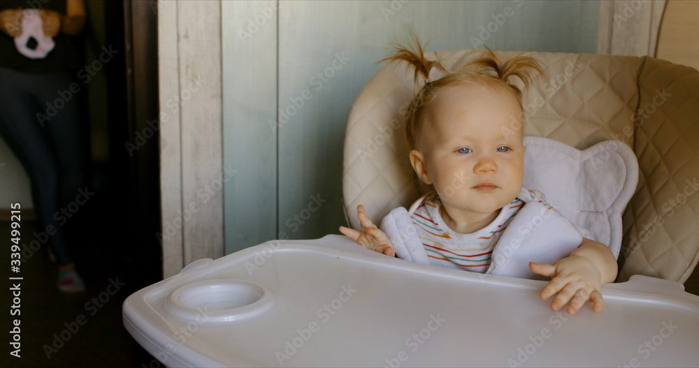 Caucasian baby waiting for meal Caucasian baby waiting for meal