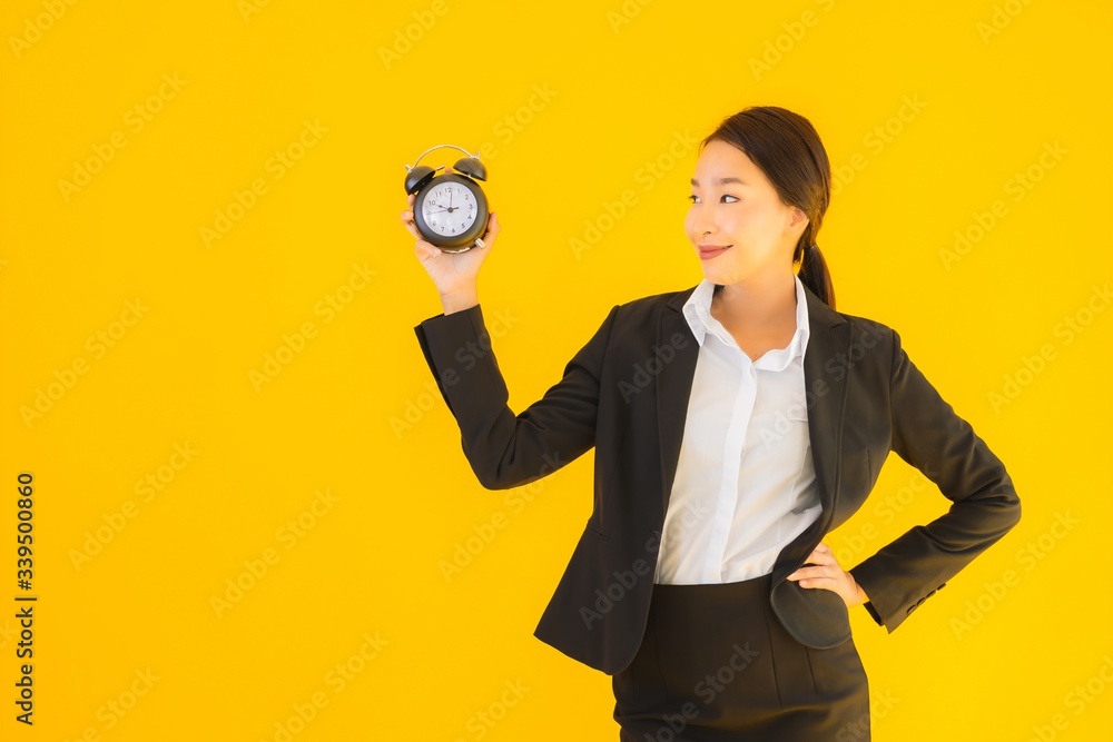 Portrait beautiful young asian woman show clock or alarm Portrait beautiful young asian woman show clock or alarm