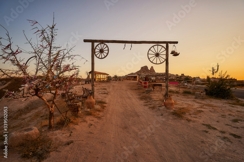Entrance to the old horse ranch in Cappadocia at dusk photo