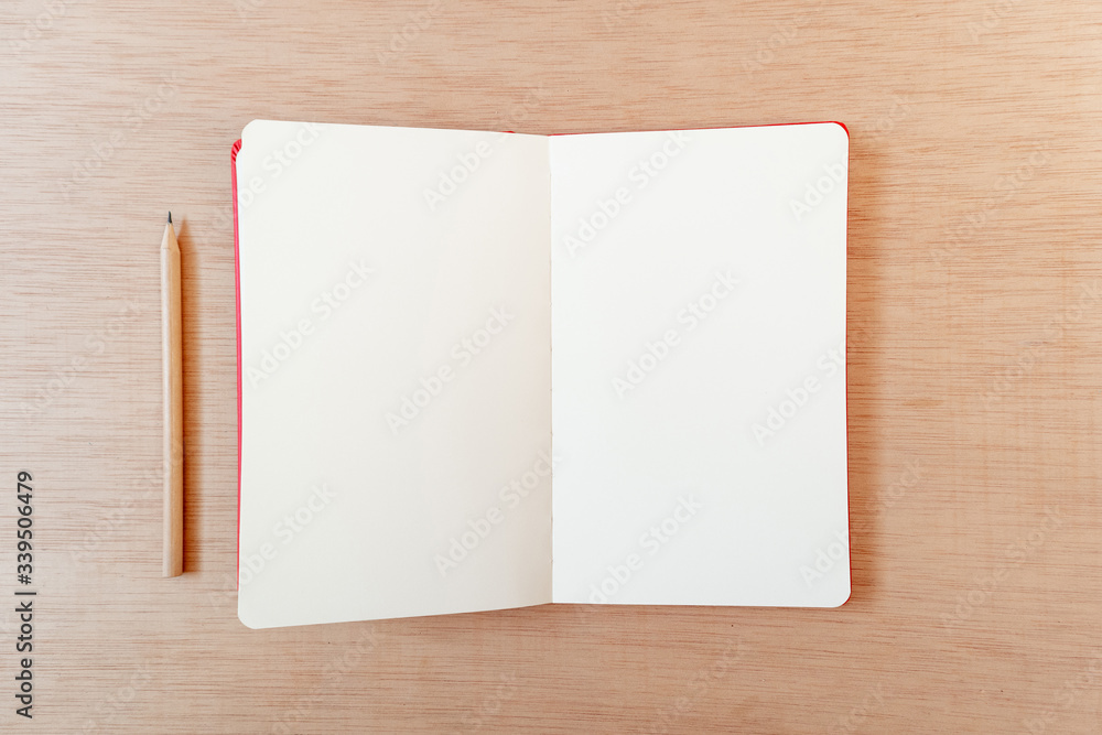Blank open notebook with a pencil in a wooden background, flat lay, copy space, template Blank open notebook with a pencil in a wooden background, flat lay, copy space, template