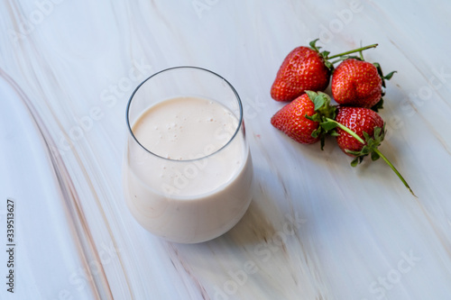 Kefir. Healthy Organic Drinkable Yogurt with Strawberries Fruit in Glass / Buttermilk Ayran.