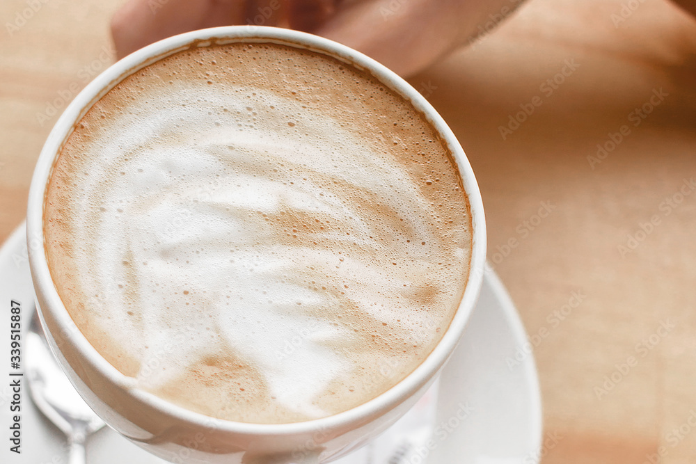 Coffee ground in hands, latte, cappuccino Coffee ground in hands, latte, cappuccino