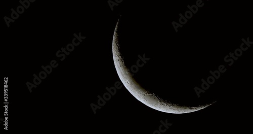 Waxing Crescent Moon filmed with 600mm tele lens in 4k photo