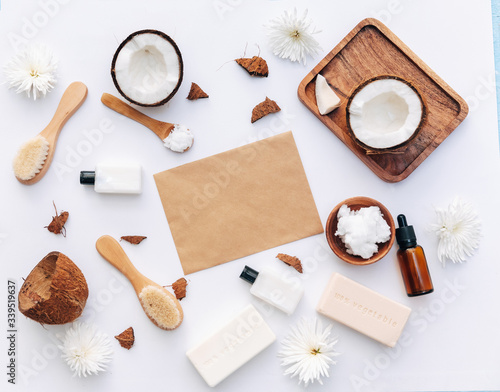 Flat Lay  Organic healthy coconut butter with coconut pieces over white background, body care products
