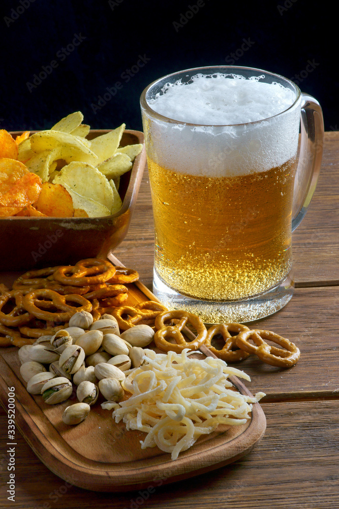 a glass of light beer with snacks a glass of light beer with snacks