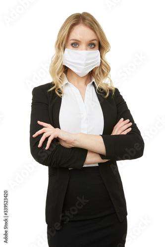 Blond businesswoman in a mask. Protection is important.