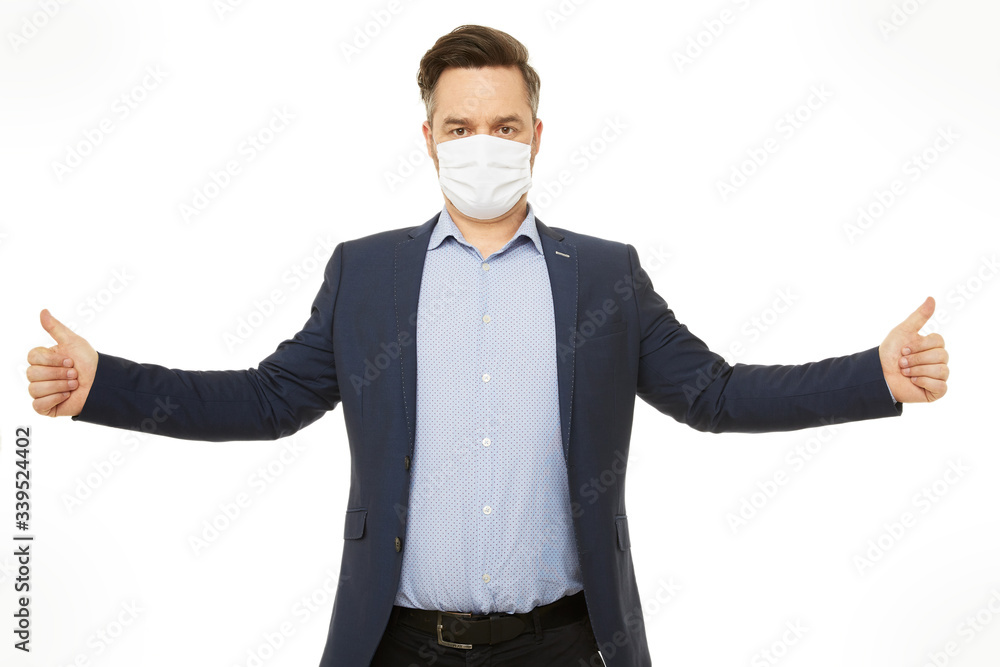 Businessman with a mask. Protection is important. Thumbs up. Businessman with a mask. Protection is important. Thumbs up.