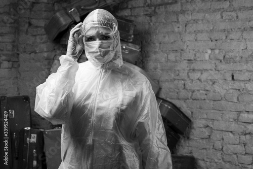 Medical worker in chemical suit from coronavirus