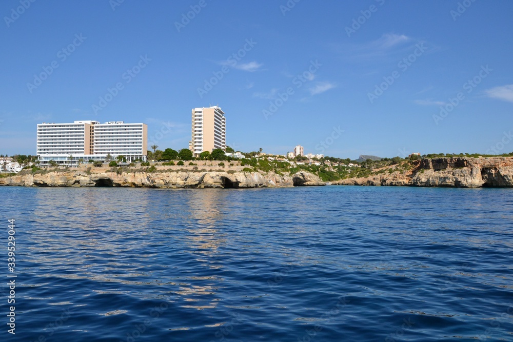 Beautiful coast of Mallorca/Majorca - Majorca coastline with caves in the rocks - view from the cruise ship, from the sea Beautiful coast of Mallorca/Majorca - Majorca coastline with caves in the rocks - view from the cruise ship, from the sea