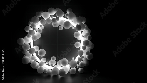 3d Rendering of illuminated torus surrounded by translucent spheres