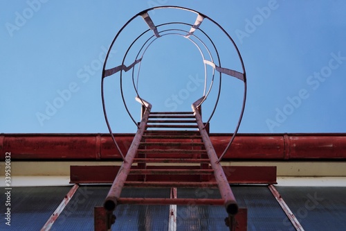 Obraz na płótnie Fire ladder on an industry building upstairs w salonie