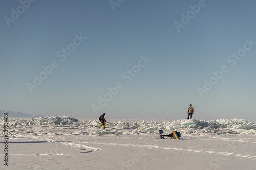 Male team of tourists with bicycles on Baikal Lake, Russia
