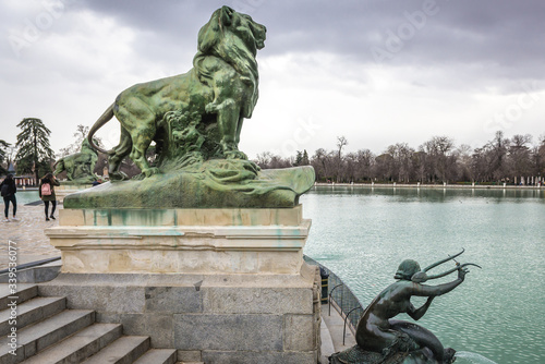 Sculptures of lion and mermaid in front of Alfonso XII monument in Retiro Park in Madrid city, Spain