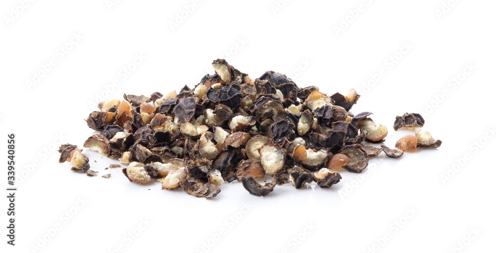 Obraz premium Ground black pepper on a white background