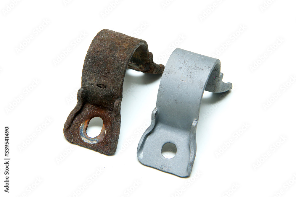 The overgrown rusty cast iron part compared with the same sand blasted part isolated in a white background. 