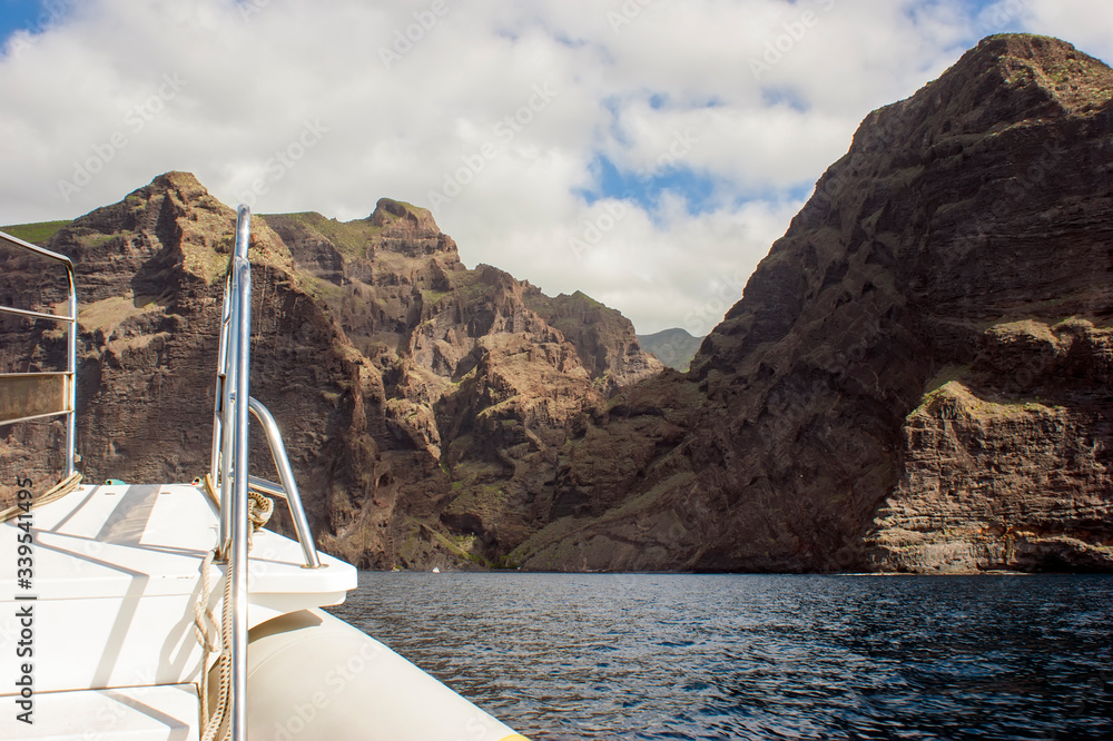 Fototapeta premium View of the Mask gorge from the ocean. The end of the trail along the Mask gorge. Observation bridge on the bow of the boat.