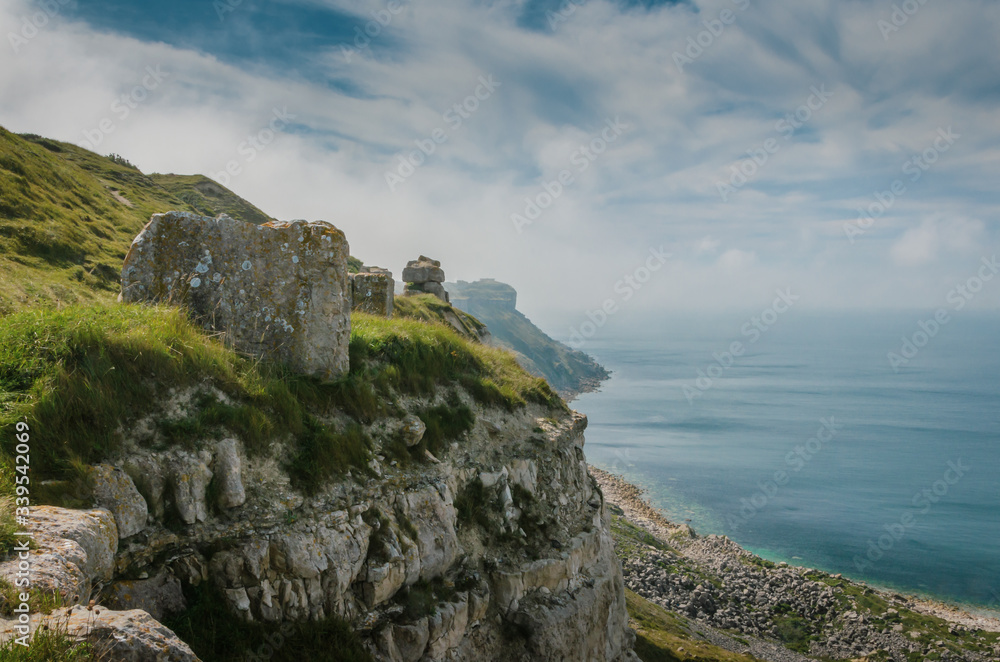 The cliffs of the Jurassic coast, Isle of Portland, Portland, Dorset, UK on a hazy and sunny Summer morning