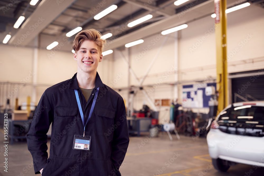 Portrait Of Male Student Studying For Auto Mechanic Apprenticeship At College Portrait Of Male Student Studying For Auto Mechanic Apprenticeship At College