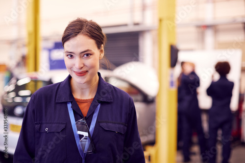 Portrait Of Female Student Studying For Auto Mechanic Apprenticeship At College