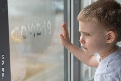 Sad  boy Looking Through The Window © linagaga
