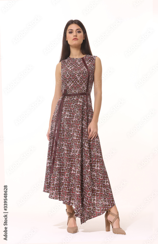 Fototapeta premium young brunette business woman executive posing in long brown short sleeve dress full body length isolated on white