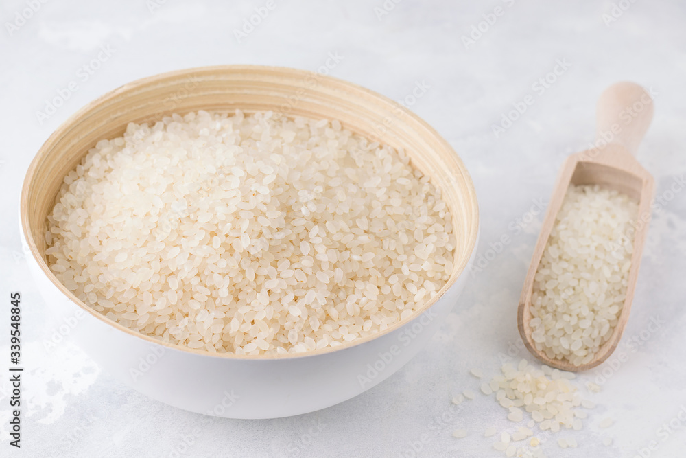 uncooked rice on a gray concrete background uncooked rice on a gray concrete background