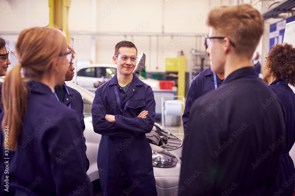 Group Of Students Studying For Auto Mechanic Apprenticeship At College Group Of Students Studying For Auto Mechanic Apprenticeship At College
