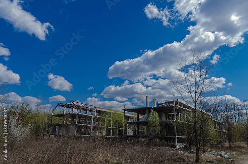 Abandoned construction site of a residential complex. Skeletons of apartment buildings. Construction in progress. Bankruptcy of an investment construction company © Alona Dudaieva