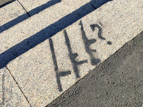 Kalashnikov assault rifle, graffiti on the asphalt.