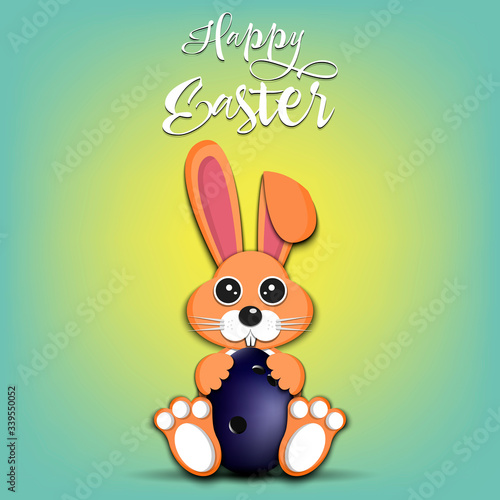 Rabbit with easter egg decorated in the form of a bowling ball