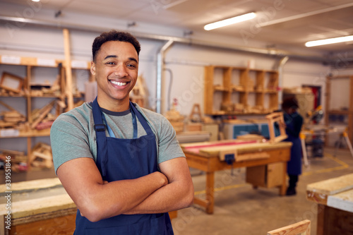 Portrait Of Male Student Studying For Carpentry Apprenticeship At College photo
