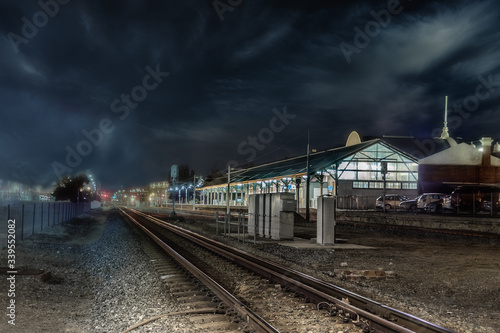Perspective view of the railways and the Fremantle train station in Western Australia at night.