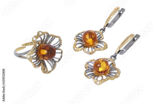 Amber jewelry set: earrings and brooсh. Baltic amber. Vintage style fashion classic jewelry. Isolated image. 