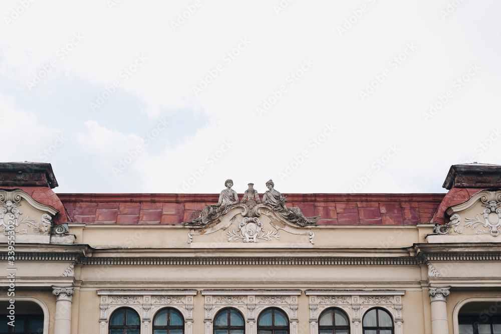 Roof of the Passage of Fellers in Lviv near the opera house. Two sculptures in the form of allegories of Commerce and Transport. The style of the modernized renaissance.